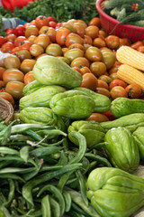 Vegetables at Asian Market with Tomatoes Chayote Okra