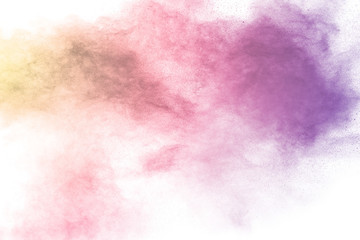 Colorful background of pastel powder explosion.Multi colored dust splash on white background.Painted Holi.