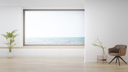 Armchair on wooden floor of large living room in modern house or luxury hotel. Minimal home interior 3d rendering with beach and sea view.