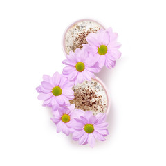 Flowers In cup of coffee tea in shape of number eight