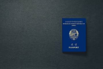 Obraz premium North Korea Passport on dark background with copy space - 3D Illustration