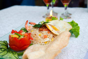 nasi goreng. indonesia fried rice well served on the table