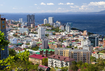 Vladivostok, Russia, September, 18, 2019: Panorama of the central part of the city of Vladivostok from the top of the Eagle's Nest hill on a clear sunny day.