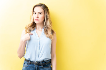 Obraz premium Annoyed Woman Is Pointing With Index Finger
