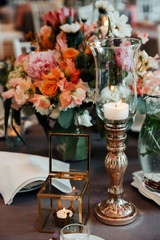 Beautiful, decorated table with flower decorations.  Wedding or party decorations.