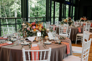 Beautiful, decorated table with flower decorations.  Wedding or party decorations.