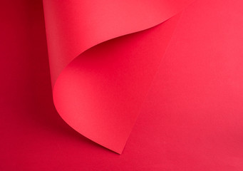 A beautiful abstract picture with two sheets of red paper. A place for text.