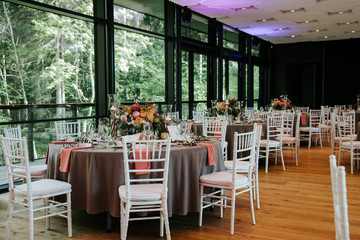Beautiful, decorated table with flower decorations.  Wedding or party decorations.