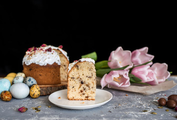 Easter composition with sweet bread, kulich and eggs on light background.