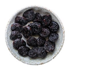 prunes, dried plums (tasty and healthy fruits) desiccated keto or paleo diet menu concept. background. top view. copy space