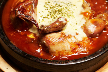 Roasted chicken with sauce and cheese 