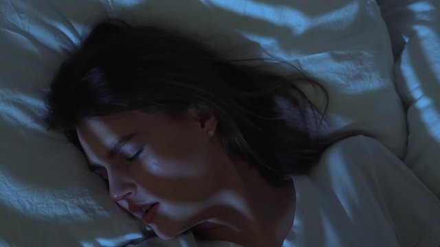 Close-up. Insomnia, Bad Dream and Restless Sleep At Night. Woman Waking up, Suddenly Terrified with Nightmare, Worries and Stress, Insomnia. Wakes Up Scared. Mental Disorders.