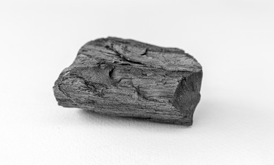 A charcoal on white background.