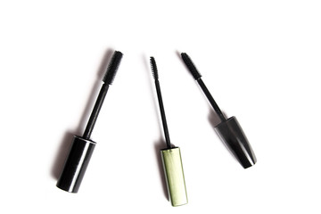 different female cosmetics on a white background