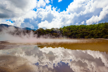 Cumulus clouds are reflected in water