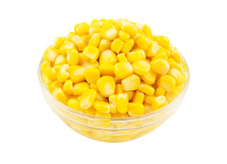 Yellow corn seeds in glass bowl isolated on white