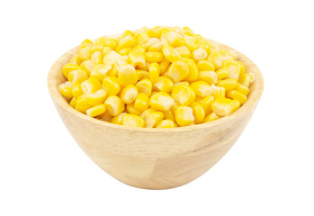 Yellow corn in wooden bowl isolated on white
