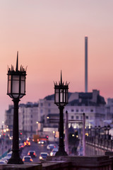 Fototapeta na wymiar lamp posts and i360 at dusk in Brighton