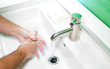 Man washing his Hands to prevent virus infection and clean dirty hands