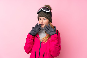 Ukrainian teenager skier girl with snowboarding glasses over isolated pink background with surprise facial expression