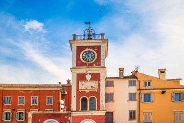 A red clock tower at The  Marsala Tita Square in Rovinj town, Croatia, Europe.