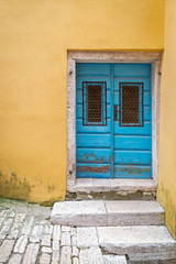 Blue entrance door of an old house in Rovinj, Croatia, Europe.