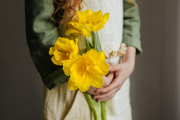 Yellow tulips in an apron pocket