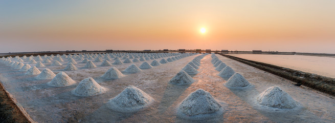 Panorama of beautiful landscape salt farm with sunset at Samutsakhon Thailand