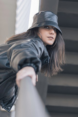 portrait of modern brunette girl in the street