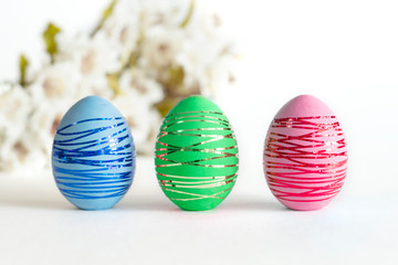 Multicolored Easter eggs on a white background.