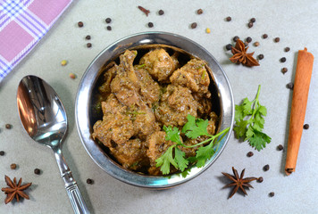 Pepper chicken curry dish with spices