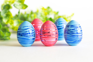 Multicolored Easter eggs on a white background.