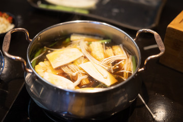 Golden needle mushroom in hot pot Sukiyaki