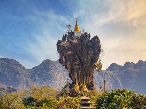 Kyauk Kalap pagoda on a limestone pinacle near Hpa-an, Myanmar