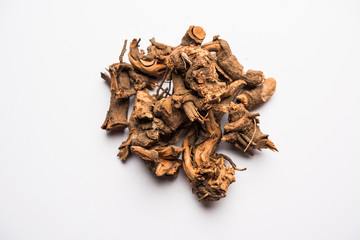 Ayurvedic herb chitrak or Plumbago zeylanica roots, isolated over white background