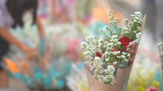 A bouquet of flowers in market for sale to gife of congraturation education to students
