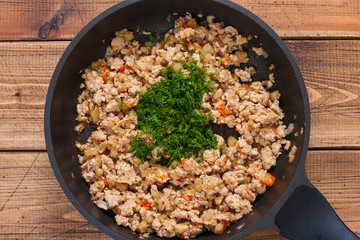 Step-by-step preparation of stuffed eggplants, step 2 - preparation of stuffing of minced meat, chopped eggplant, tomatoes, top view, horizontal