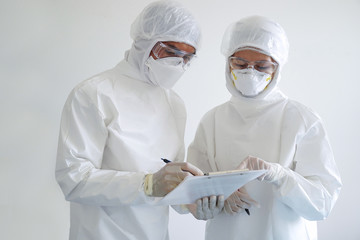 doctor and nurse wearing PPE and looking for corona/covid-19 virus infected patient's laboratory...