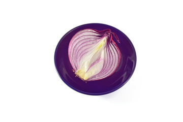 Blue onion in a black plate on a white background