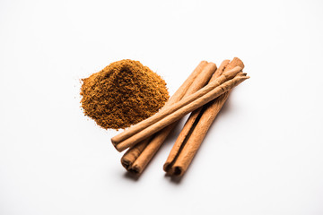 Powder cinnamon and sticks also known as Dalchini or Dalcheenee masala from India, selective focus