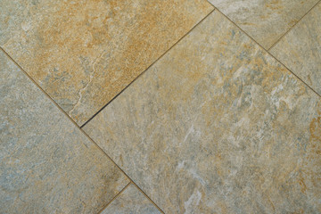 Photography of the tiled floor in the house. Close view from above.