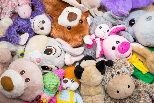 Many Soft plush fluffy toys sits in the children's room
