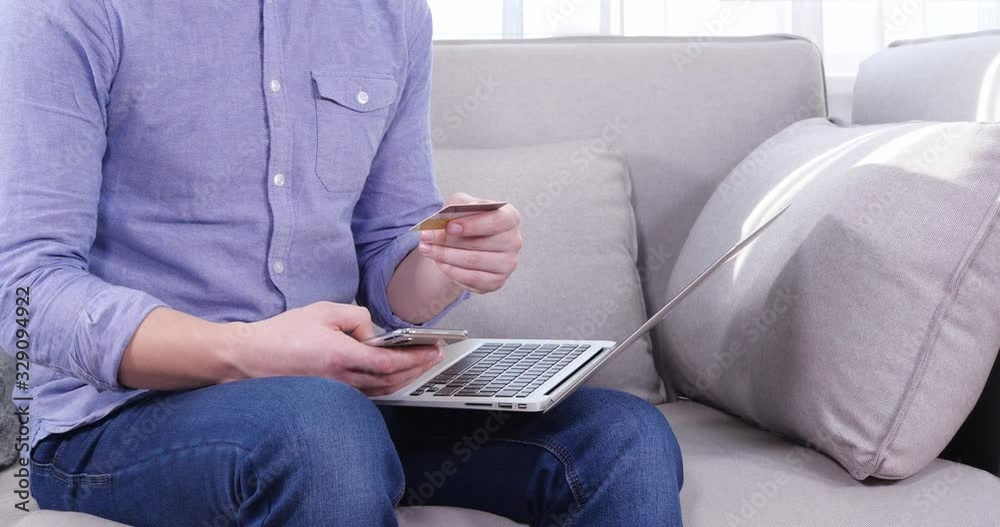 Canvas Prints Man entering credit card data for online payment indoors, closeup