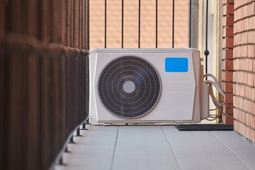Exterior unit of an air conditioner outside an apartment