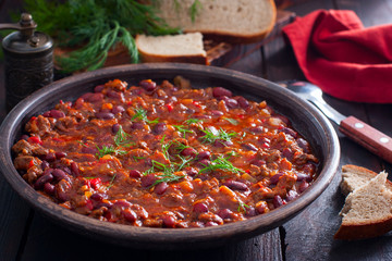 Chili con carne, traditional Mexican dish with beef and beans, selective focus