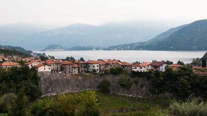 Fototapeta na wymiar views of the mountains, Lake Como and the ancient wall in Ossuccio, Lenno, lake Сomo, Tremezzina, Italy