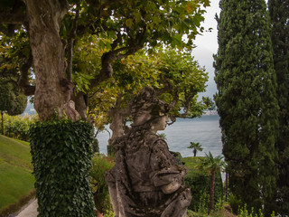 beautiful views, green lawns, trees, bushes and sculptures of the Villa Balbianello, Lenno, lake Сomo, Tremezzina, Italy