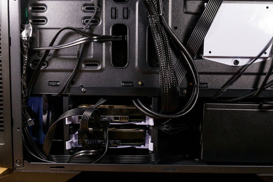 Close-up of new computer system unit with installed hard drives. Desktop PC from the inside