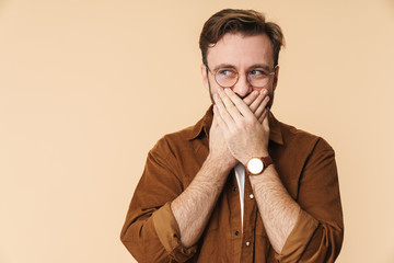 Portrait of a cheerful young arttractive bearded man