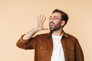 Portrait of a cheerful young arttractive bearded man